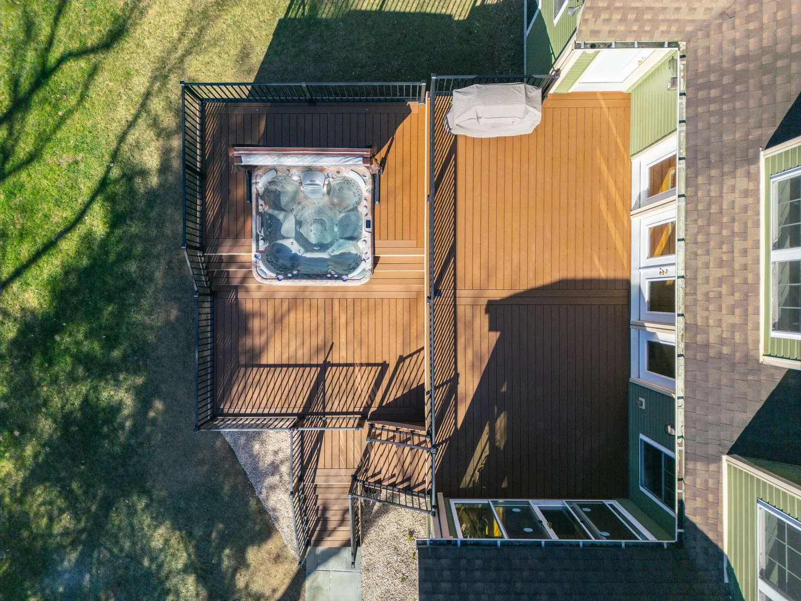 Aerial of a custom Trex deck and hot tub in the Hudson Valley