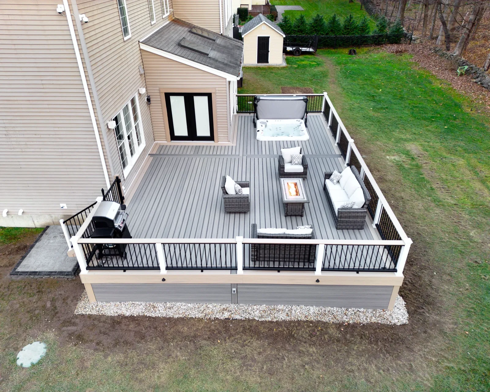 Fire pit and hot tub outdoor living space, front view