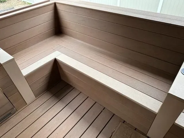 Covered porch with built-in bench on a rolling Orange County lot