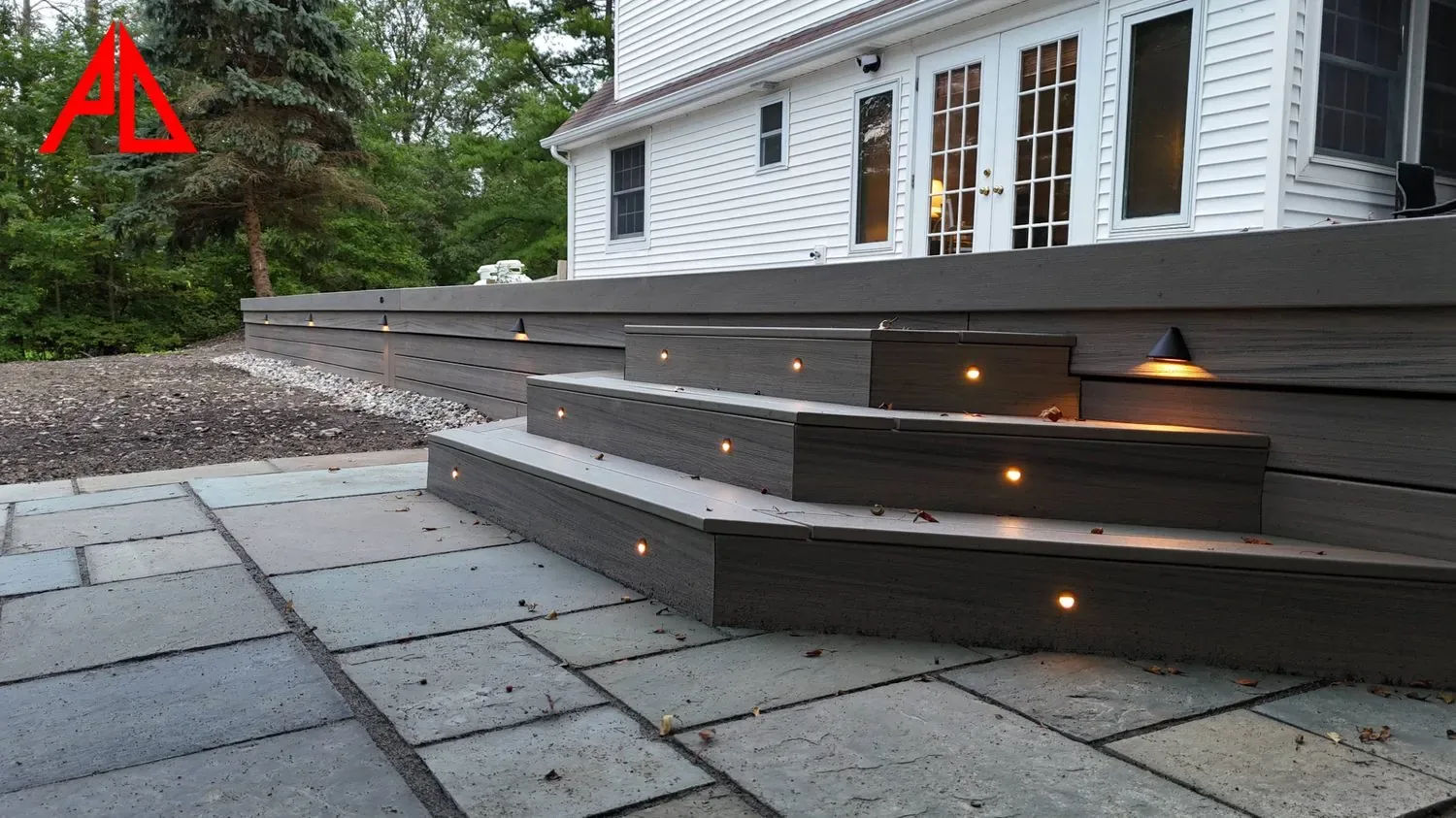 Multi-level Westchester deck with lighted steps at night