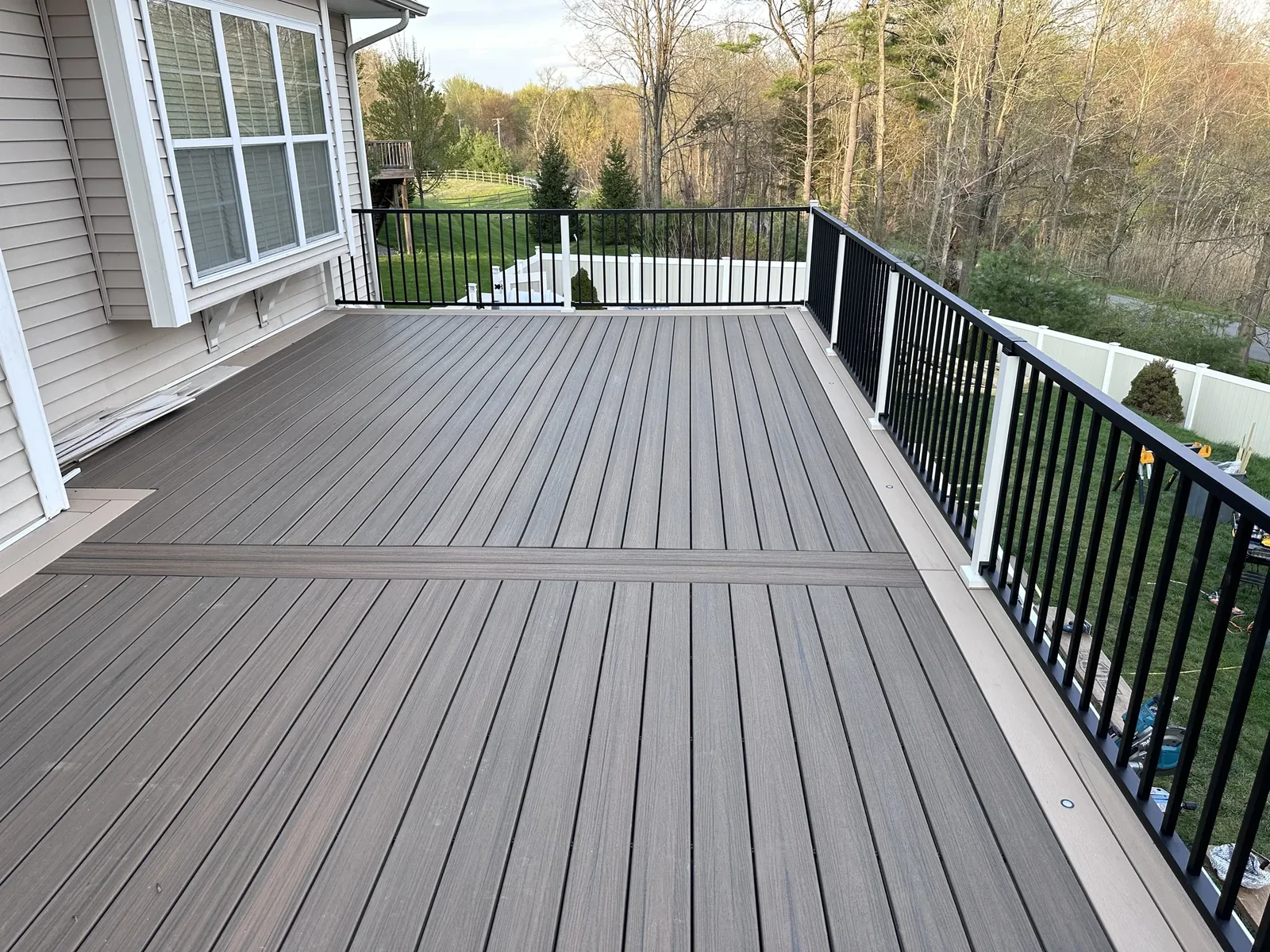 Trex composite deck with black railing in the Hudson Valley